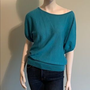 Off the shoulder teal short sleeve sweater.